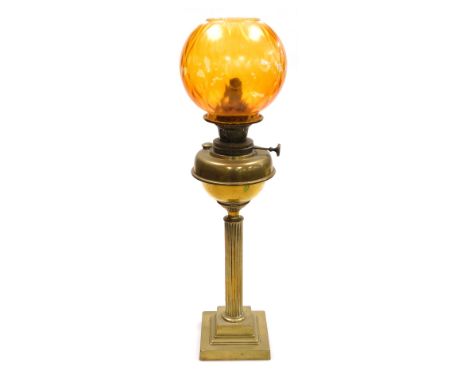 A Young's brass oil lamp, converted to electricity, of fluted column form, raised on a stepped square base, with inside hand 