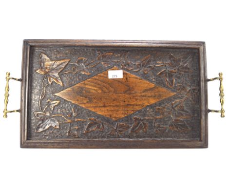 A 20th century carved oak butlers tray, the top decorated with vines and leaves, twin handled, 57cm long