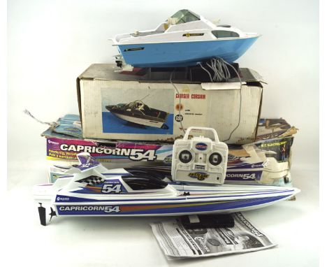 Two battery powered toy boats, comprising a Corsair II cruiser and a Compass Capricorn 54, both with controllers and in the o