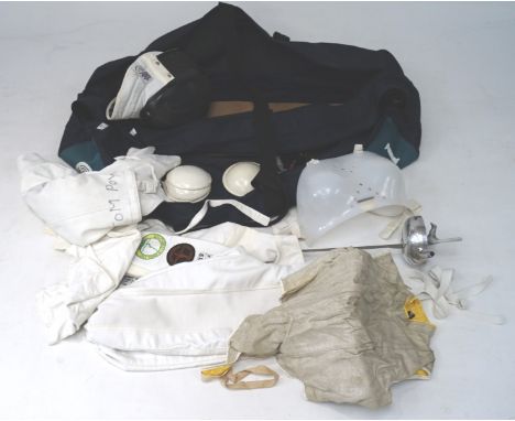 A collection of Leon Paul fencing gear in travel bag, including foil, helmet, jacket, etc
