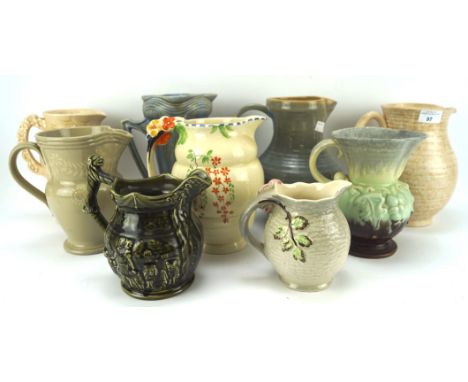 An assortment of ceramic jugs, including examples by Arthur Wood, Staffordshire, Royal Doulton, etc, largest H23cm 