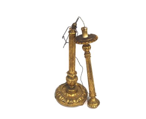 A gilt wood two part standard lamp with fluted support and on a round base carved with leaves, H146cm to fitting