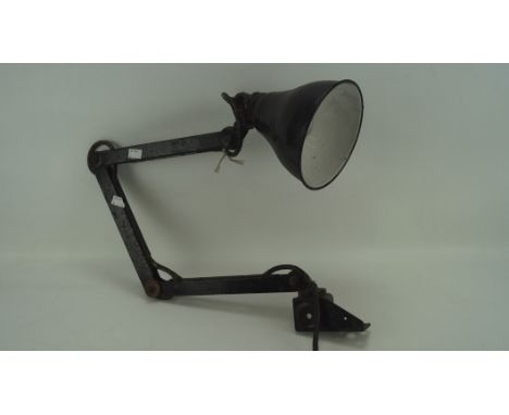 A mid-century black painted anglepoise style desk lamp, with black enamel shade, possibly WWII era