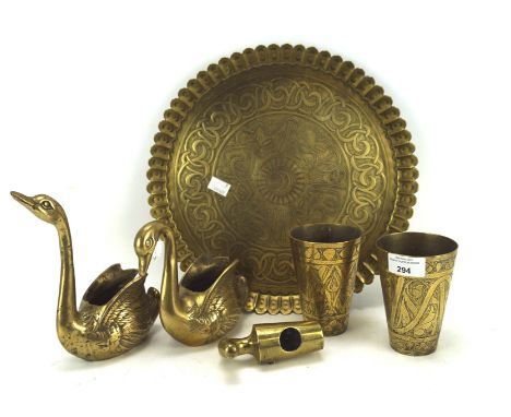 Assorted brassware, including a Middle Eastern embossed tray and two similar beakers, etc