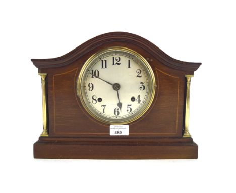 A late 19th/early 20th century Staines mantel clock, the silvered dial with Arabic numerals and flanked by gilt columns, with