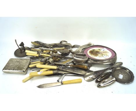 An assortment of silver plate, including a cigarette case, flatware, a Ronson table lighter and other items