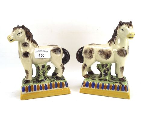 A pair of 20th century Staffordshire ceramic figures of horses, H18cm 