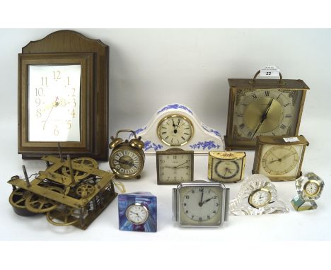 An assortment of small desk clocks and similar wares, including brass, ceramic, wooden and glass examples