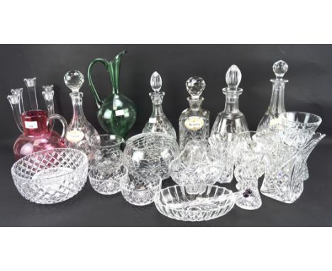 An assortment of glassware, including five decanters, a candlestick, salad bowl, green ewer, etc