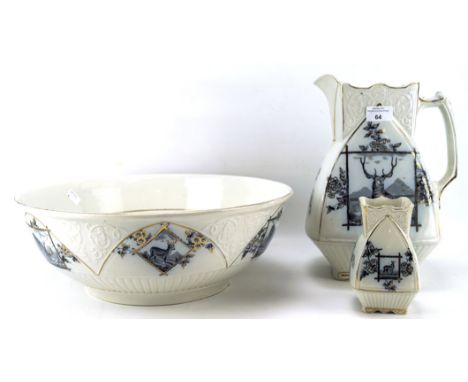 An early 20th century ceramic wash basin set, comprising pouring jug, basin and a small vase, each decorated with stags