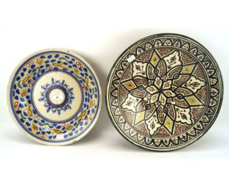 Two 20th century Moroccan ceramic dishes, of circular form, colourful decoration, largest DIAM 39cm