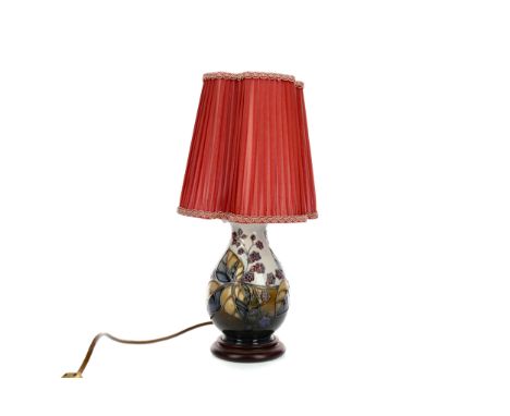 CONTEMPORARY MOORCROFT TABLE LAMP, of baluster form, tube-lined with fruiting foliage on a graduated sky to dark blue ground,