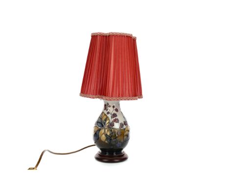 CONTEMPORARY MOORCROFT TABLE LAMP, of baluster form, tube-lined with fruiting foliage on a graduated sky to dark blue ground,