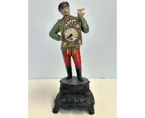Cast metal clock with key 
