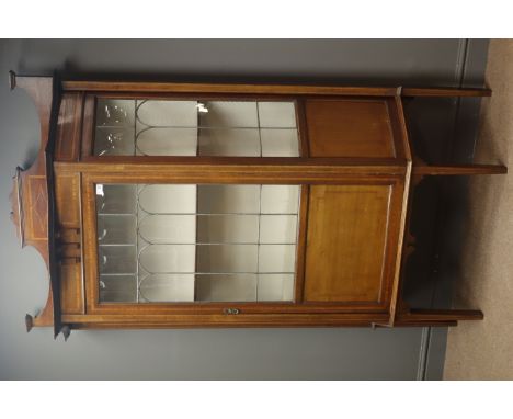 Edwardian inlaid mahogany display cabinet, raised back, shaped front, lead glazing, single door enclosing adjustable shelf, t