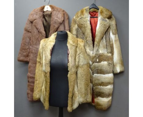 Two three quarter length and one short fur coat, possibly rabbit, lined, approx sizes S/M Condition Report Click here for fur