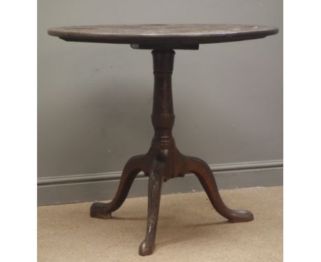 19th century mahogany tilt top tripod table, circular carved top with wells, single turned column, three acanthus carved spla