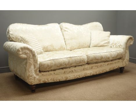 Three seat sofa upholstered in gold fabric with floral pattern, turned supports, W224cm Condition Report Click here for furth