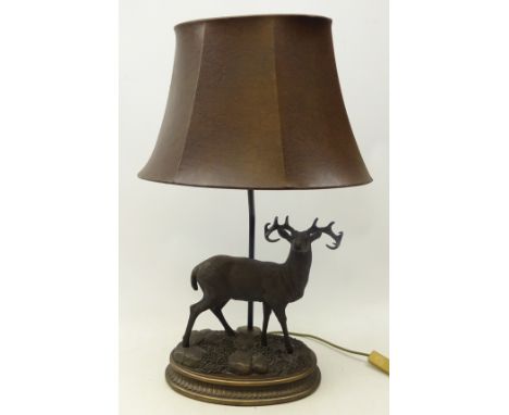 Bronzed table lamp mounted with Stag on rocky oval vase with leather shade, H67cm  Condition Report Click here for further im