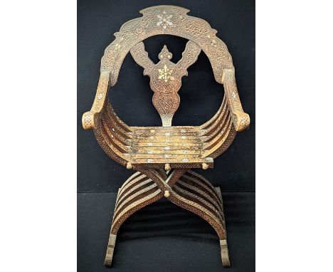 A Syrian folding chair, carved detail with mother of pearl inlay