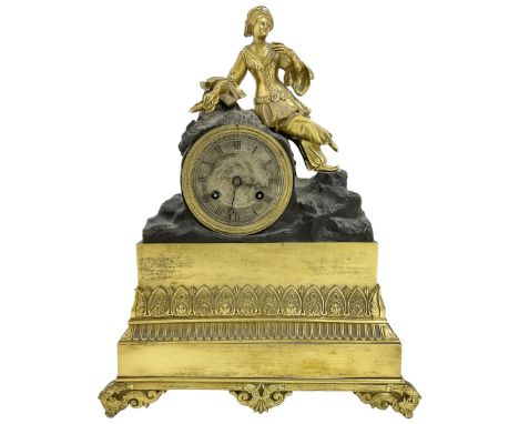 French early 19th century 8-day mantle clock, with a gilded figure of a  Turkish lady resting on a drum enclosed Parisian mov