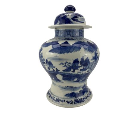 19th century Chinese blue and white vase and cover, of inverted baluster form, painted with a continuous mountainous landscap