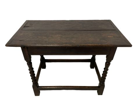 17th century oak side table, cleated and pegged two plank top over moulded front rail, on bobbin turned supports joined by pl