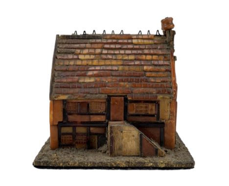 18th century North European amber and tortoiseshell model of a half-timbered, two storey farmhouse, with tiled roof, mother-o