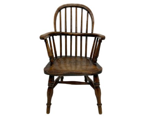 19th century child's elm Windsor chair, double hoop stick back over dished seat, raised on ring turned supports united by swe