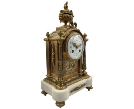 Cherillier - Paris, late 19th century brass cased 8-day mantle clock on a white marble base, break arch top with non matching