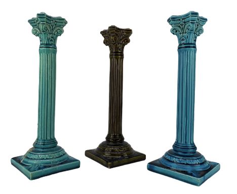 Pair of Burmantofts turquoise-glaze corinthian column candlesticks, H29cm and another in an olive green glaze, all having imp