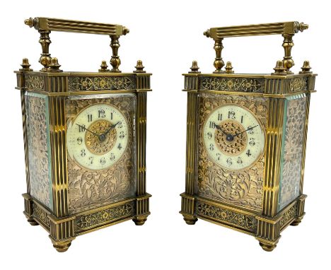French - Pair of Edwardian 8-day timepiece carriage clocks with bevelled rectangular glass panels and overlaid friezes in gil