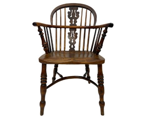 19th century yew wood and elm Windsor chair, low hoop stick back with pierced ad figured splat, dished seat raised on ring tu