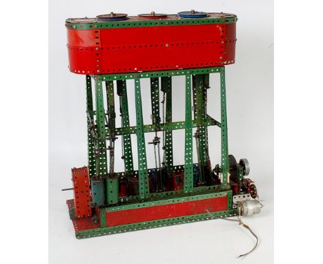 A home built model of a Meccano triple expansion steam engine mainly constructed from 1950s red and green components, fitted 