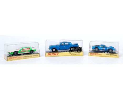 Three plastic cased Dinky Toys diecast to include No. 189 Lamborghini Marzal, No. 216 Dino Ferrari, and No. 158 Rolls Royce S