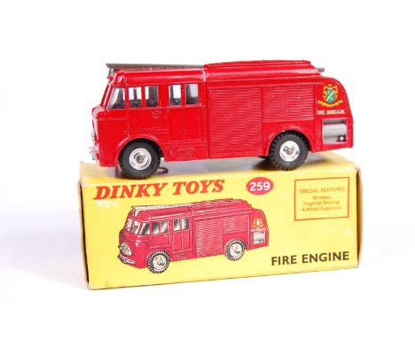 Dinky Toys No. 259 fire engine, with red body and silver detailing, spun hubs in the original pictorial yellow all-card box