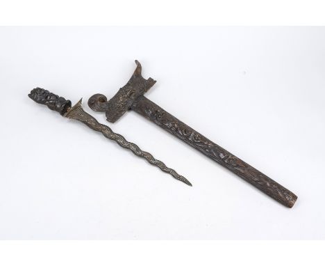 Kris, Indonesien 19./20. Jh., Scheide und Griff aufwändig und figürlich beschnitzt, ber. und leicht best., L. 69 cm