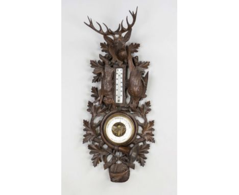 Jagdliches Barometer, Anfang 20. Jh., durchbrochen gearbeitete Schnitzarbeit mit Jagdtrophäen. Barometer und Thermometer mit 