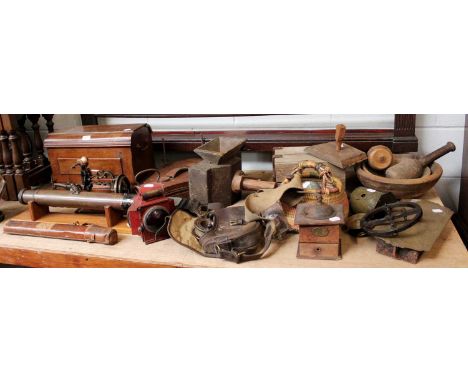 A Collection of Victorian Kitchenalia, including dug out bowls, brass spit jack, coffee grinder, together with a brass gun si