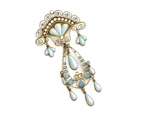 An Arts &amp; Crafts Style Enamel Brooch, the white shield motif with scroll work surround to a central pear shaped drop, wit