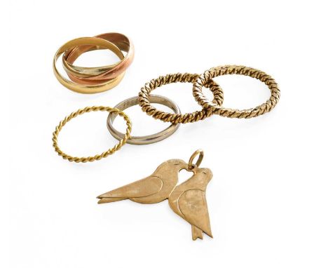 ~ A 9 Carat Gold Bird Pendant, measuring 3.4cm by 2.7cm; A 9 Carat Gold Russian Band Ring, finger size I1/2; Two Twist Band R