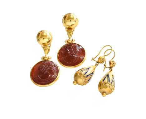 A Pair of Carnelian Drop Earrings, the carved circular plaque carnelians in yellow rubbed over settings, with post fittings, 