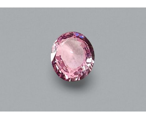 AN UNMOUNTED UNHEATED 'PADPARADSCHA' SAPPHIRE
Featuring an oval cut light orangy pink spinel weighing 1.12 Cts, measuring app