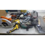 Ten assorted power tools including a planer, hammer drill, circular saw, etc.