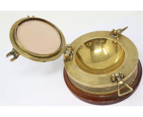 Wood and brass port hole form inkwell, D: 12 cm. P&amp;P Group 1 (£14+VAT for the first lot and £1+VAT for subsequent lots) 