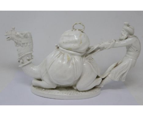 Moore Brothers teapot in the form of a man tying a pack on the hump of a camel, L: 31 cm, discoloration but no chips or crack