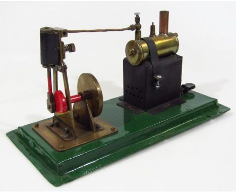 A mid 20thC Mamod style table top stationary engine, with cylinder burner attached to an articulated wheel, on a stepped base