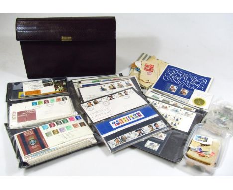 A leather finished document wallet, containing a quantity of various ephemera, stamps, first day covers, first day cards, mai