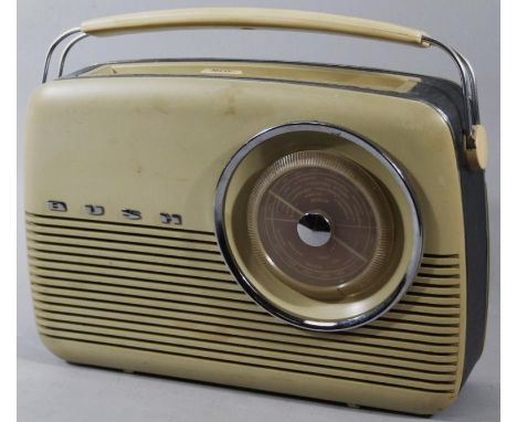 A mid 20thC retro Bush radio, with articulated handle and grille speaker front with raised lettering, 34cm wide.