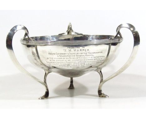 An Edwardian Scottish silver Art Nouveau bowl, of shaped circular outline with an upper reeded rim and 'C' scroll handles, on